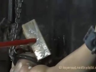 Clamped up gal gets her fuck holes tortured